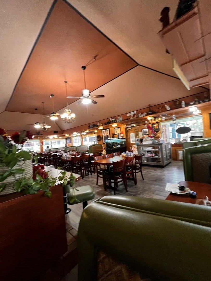 Bright family restaurant dining room with tables and booths.